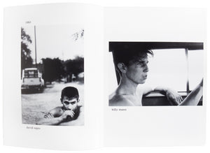 Interior view of Larry Clark's "Tulsa", with portraits of two young men.