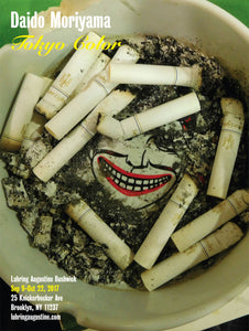 Side one of a double-sided poster from Daido Moriyama's 2017 exhibition titled "Tokyo Color," featuring an image of an ashtray full of cigarette butts.
