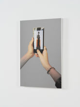 Load image into Gallery viewer, Side angle view of silkscreen on polished steel by Michelangelo Pistoletto. 