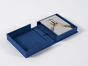 Image of interior of boxed set by Michelangelo Pistoletto with silkscreen on steel and book, with book boxed under silkscreen. 
