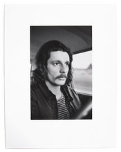Load image into Gallery viewer, Image from Larry Clark&#39;s &quot;Kiss the Past Hello&quot; set. Black and white photograph of a man at the wheel of a car.