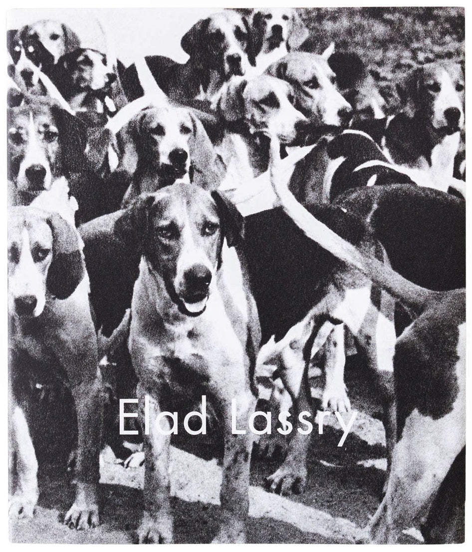 Image of the cover of the 2010 Luhring Augustine catalog on occasion of an Elad Lassry exhibition, with a black and white photograph of dogs.  