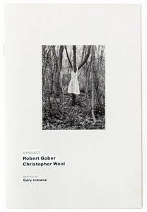 Image of the cover of "A Project" by Christopher Wool and Robert Gober, with a black and white photograph of a dress on a tree.
